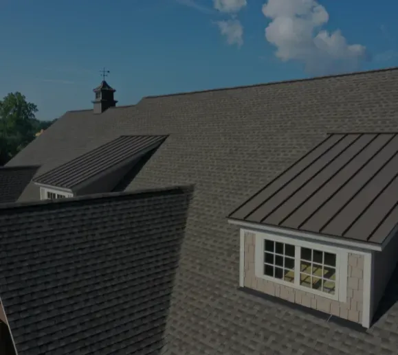 An aerial view of a house with a roof and a window