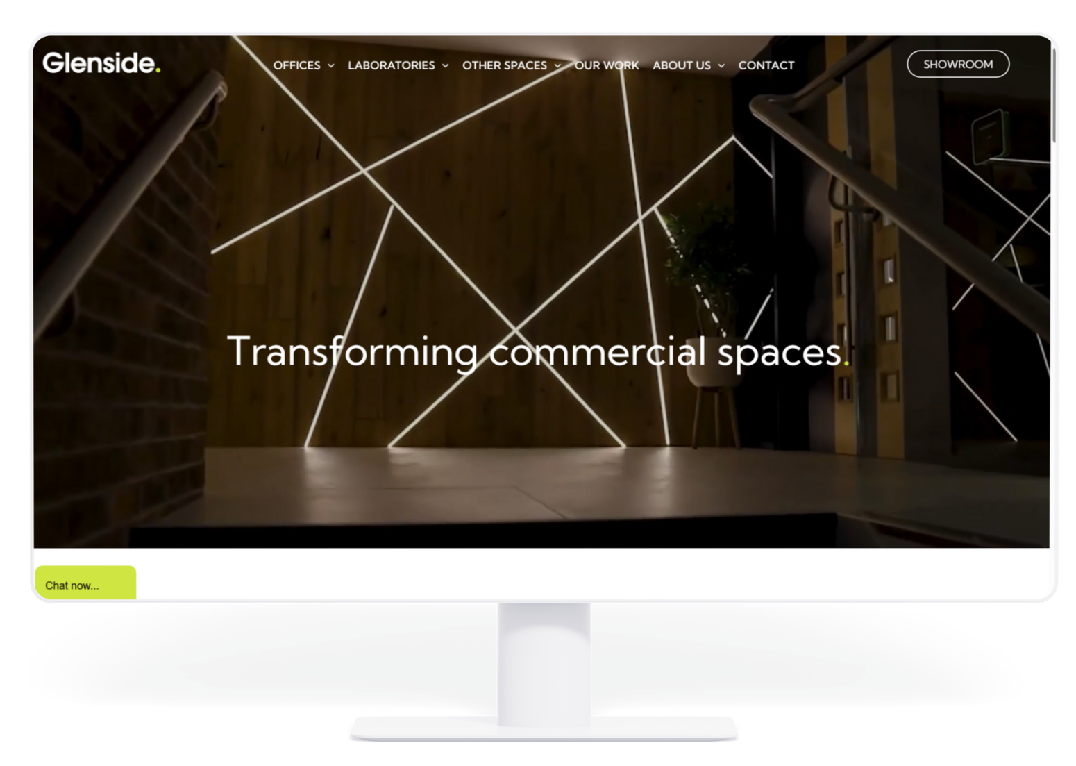 Website homepage showcasing a modern commercial space interior with linear lighting. "Transforming commercial spaces."