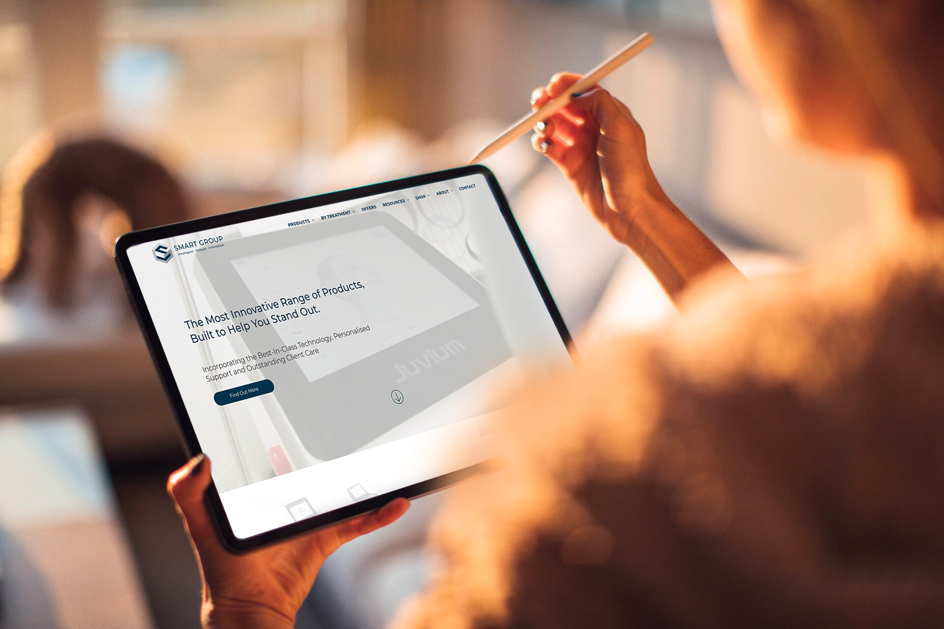 Woman using a tablet with a website open, holding a stylus indoors.