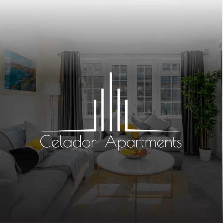 A living room with a couch and a coffee table and the logo for celador apartments.