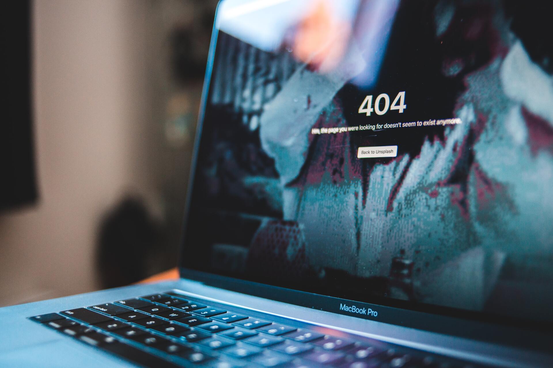 A laptop computer is open to a page that says 404 on it.