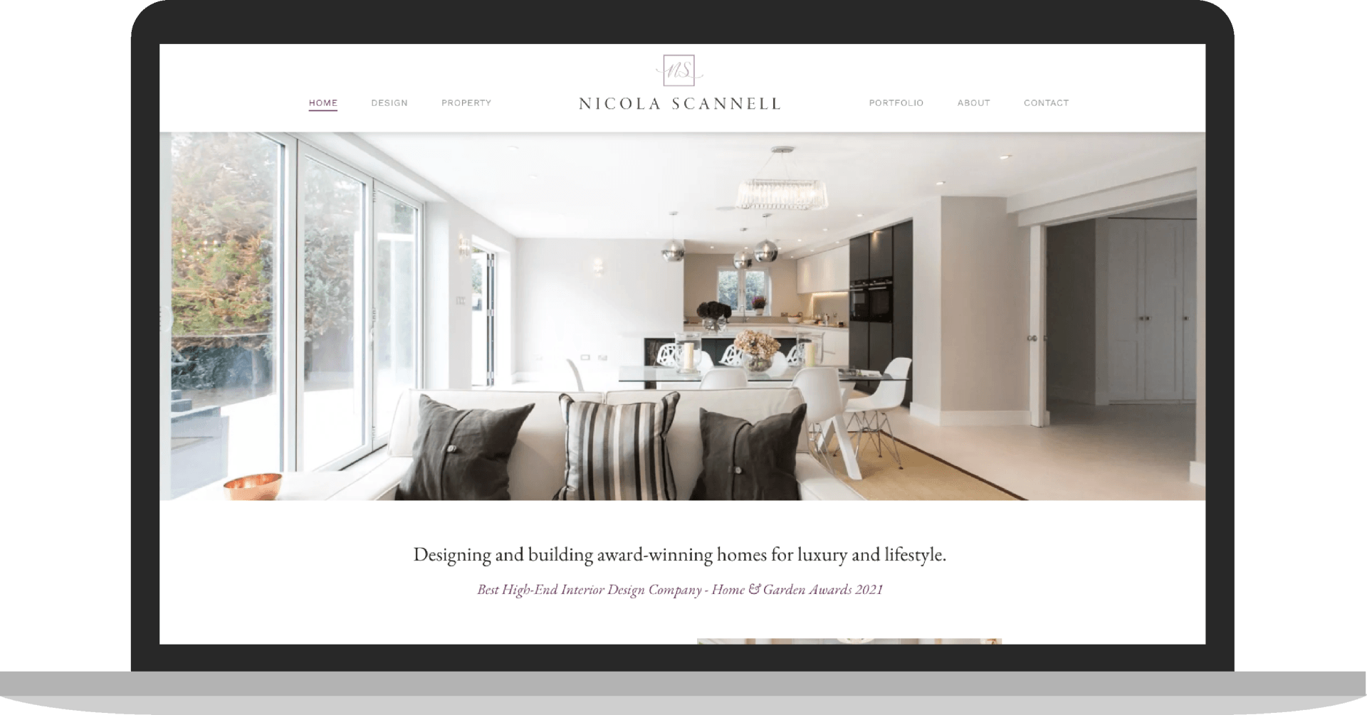 A laptop with a picture of a living room on the screen. Digity marketing agency