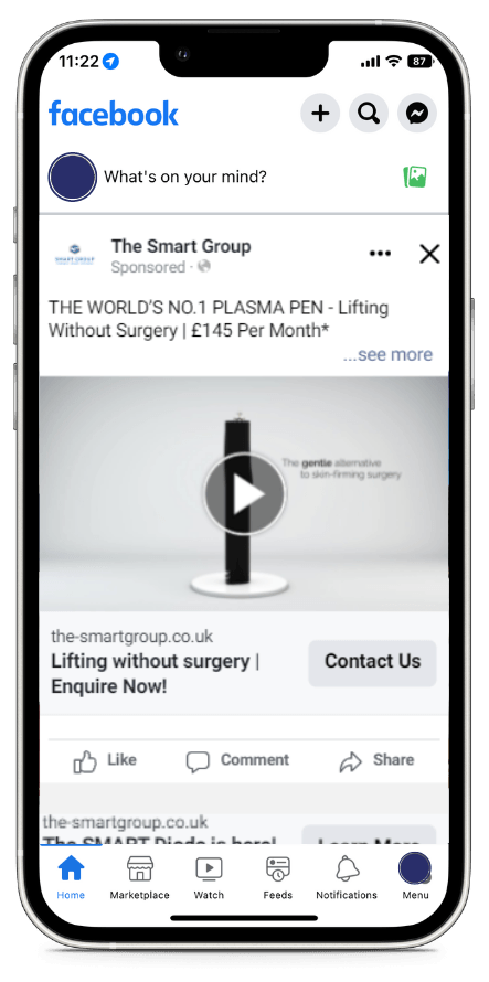 A cell phone is open to a facebook page.