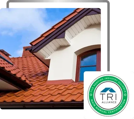Red-tiled house roof and dormer window under blue sky, with TRI Alliance seal in the corner
