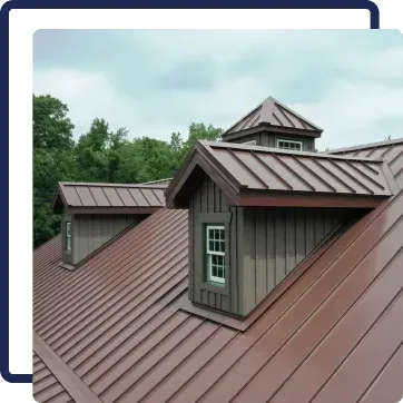 Copper metal roof with dormer windows and a small cupola on a house, viewed against cloudy sky