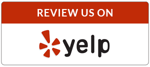 Red and white Yelp review badge with the Yelp logo and “REVIEW US ON” text