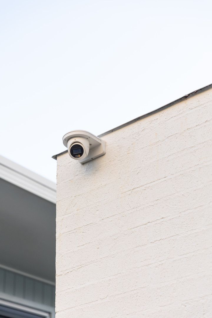 Security Camera Mounted on a White Building Exterior — Stewys in Kingscliff, NSW
