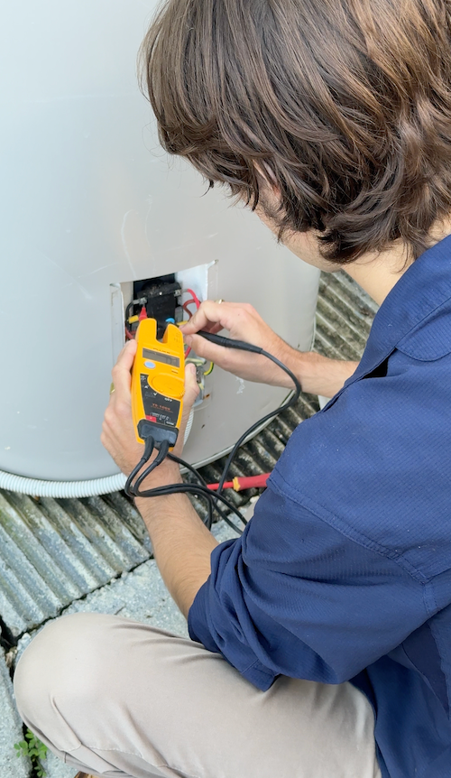 Technician Using A Yellow Multimete — Stewys in Tweed Heads, NSW