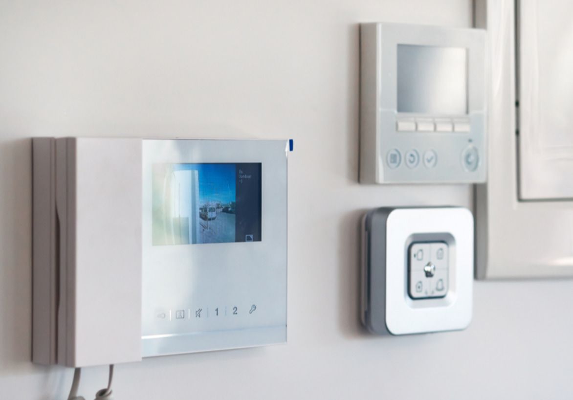 A White Telephone With a Screen on It is Hanging on a White Wall — Stewys in Casuarina, NSW