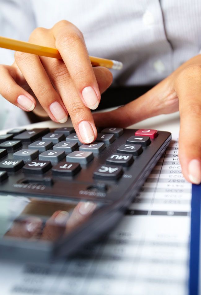 CPA typing on computer finishing tax returns