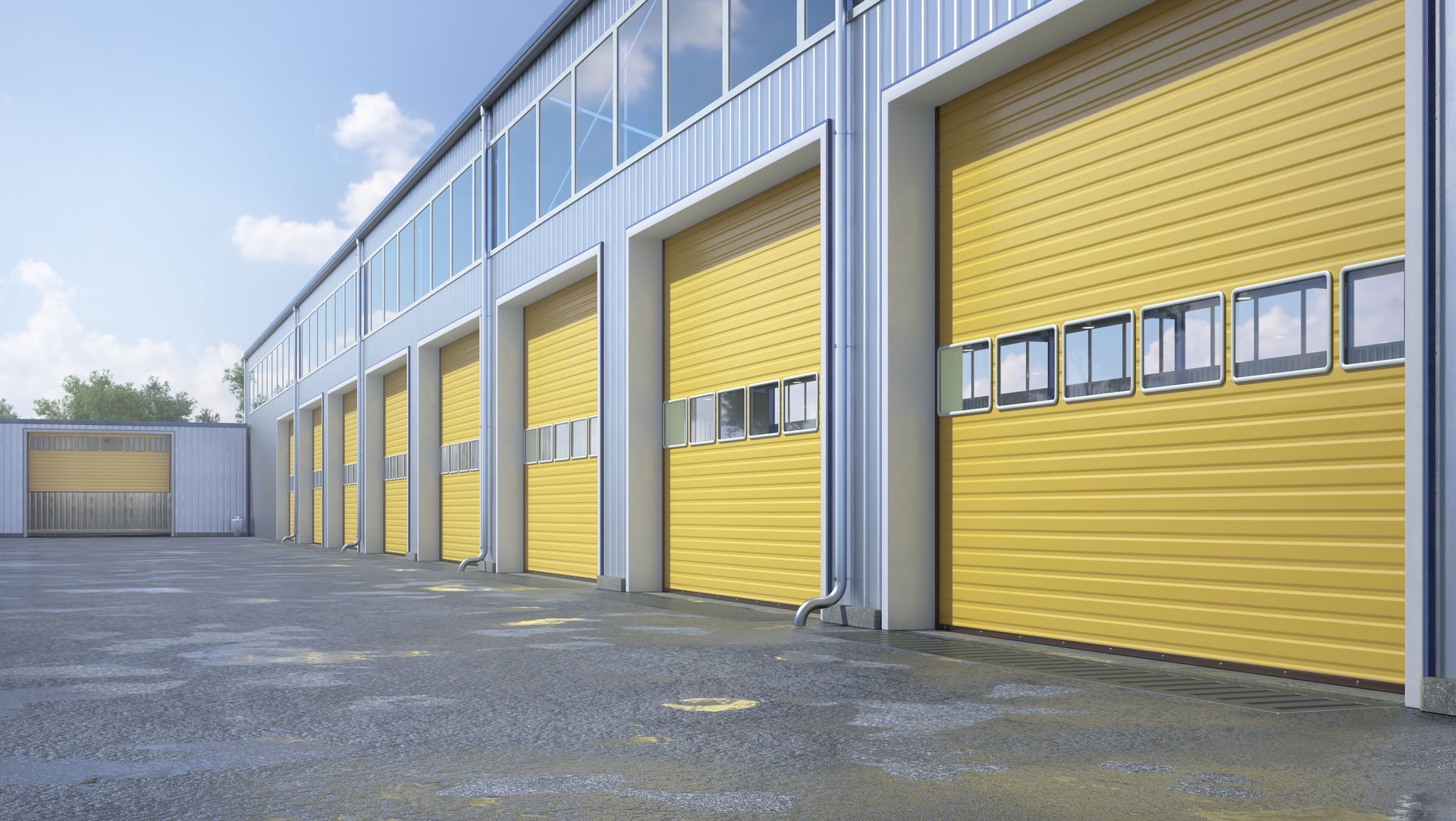 A row of yellow garage doors on the side of a building.