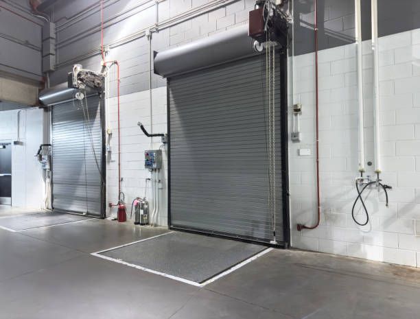 A warehouse with a lot of doors and pipes.
