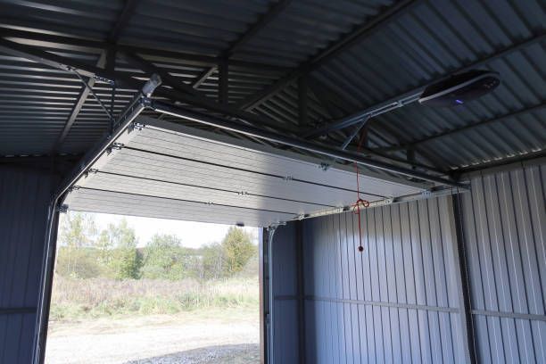 A garage door is open in a metal building.