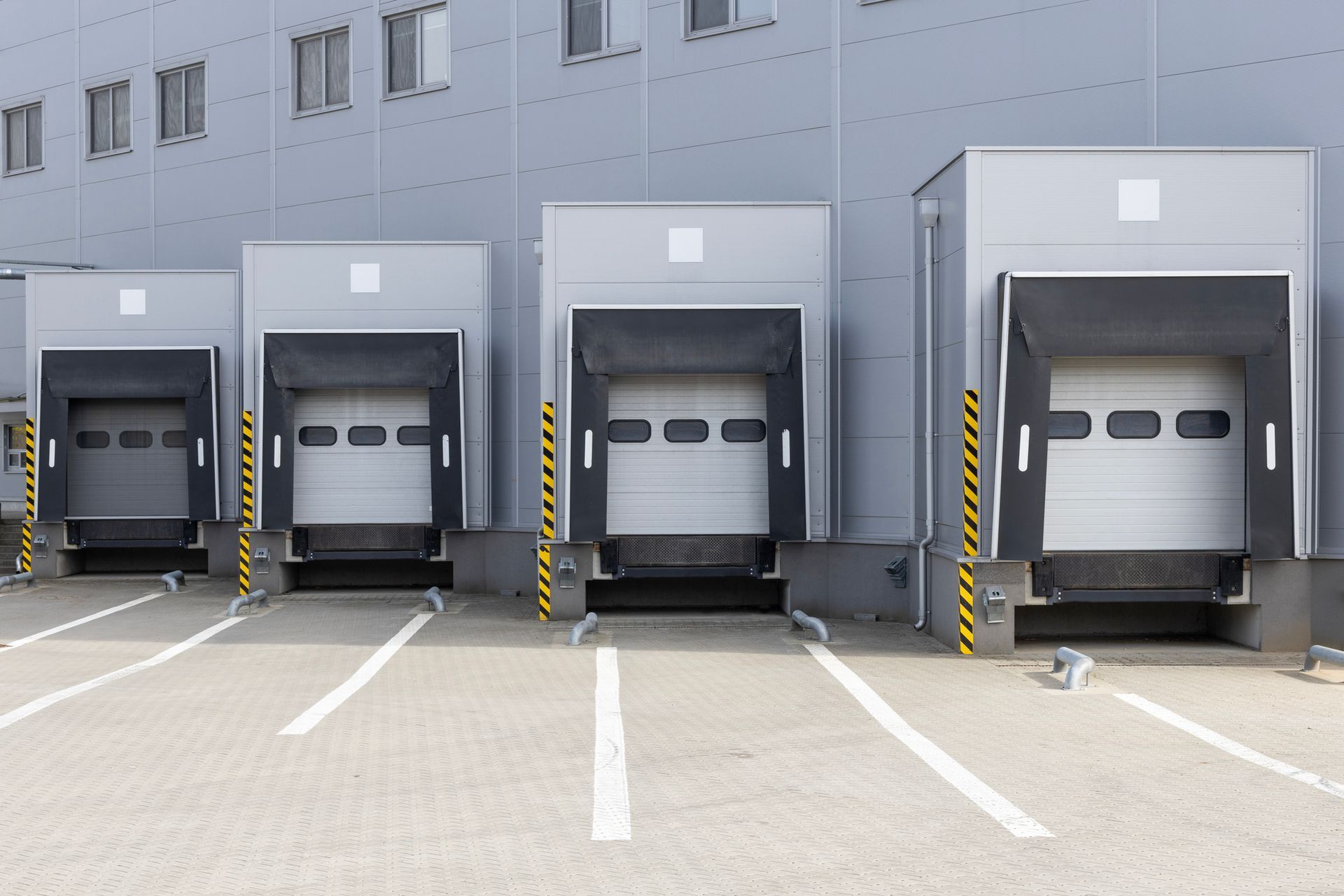A row of loading docks in front of a warehouse.
