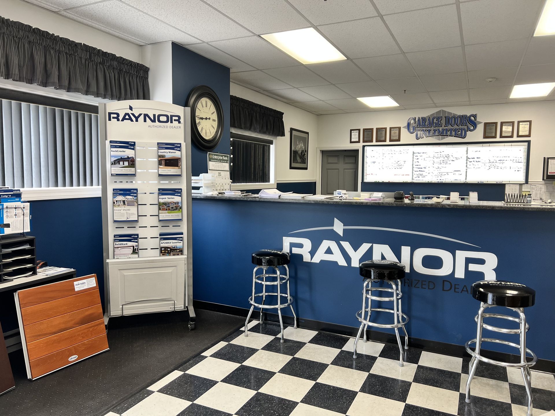 A raynor store with a checkered floor and stools.