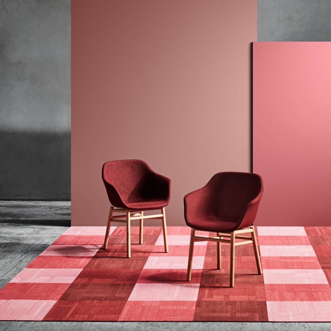 Two Red Chairs Are Sitting on a Checkered Rug — Hoppens Floorworld in Manunda, QLD