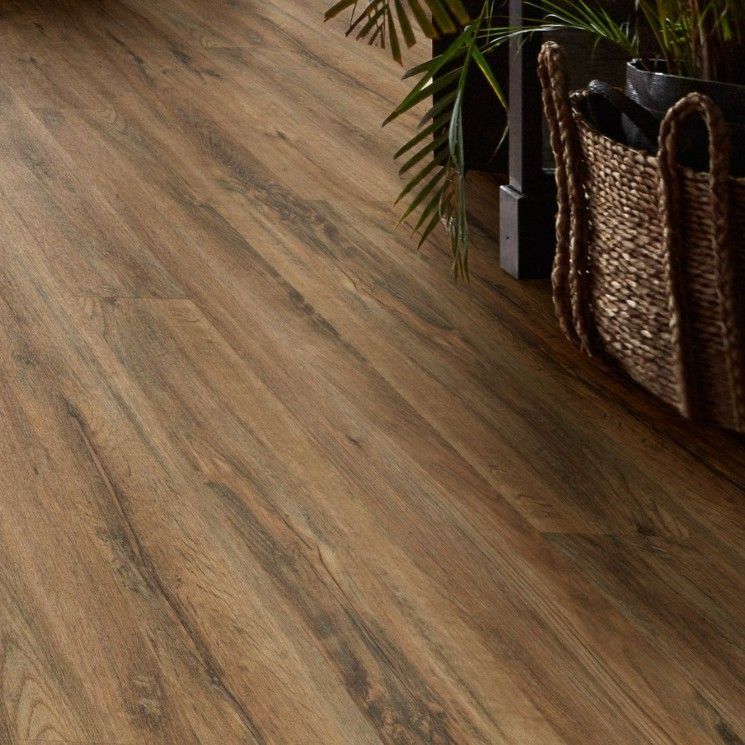 Brown Wood-look Flooring With Plant Leaves and a Woven Basket in the Background — Hoppens Floorworld in Smithfield, QLD