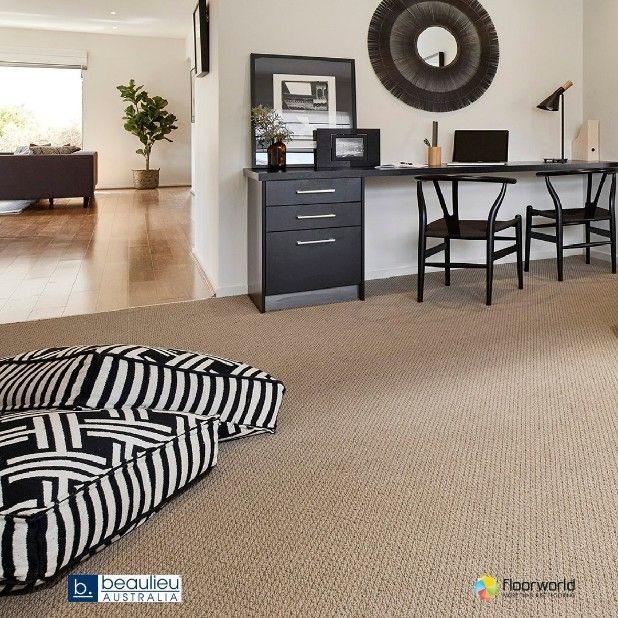 A Living Room With a Desk and Chairs and Striped Pillows — Hoppens Floorworld in Mooroobool, QLD