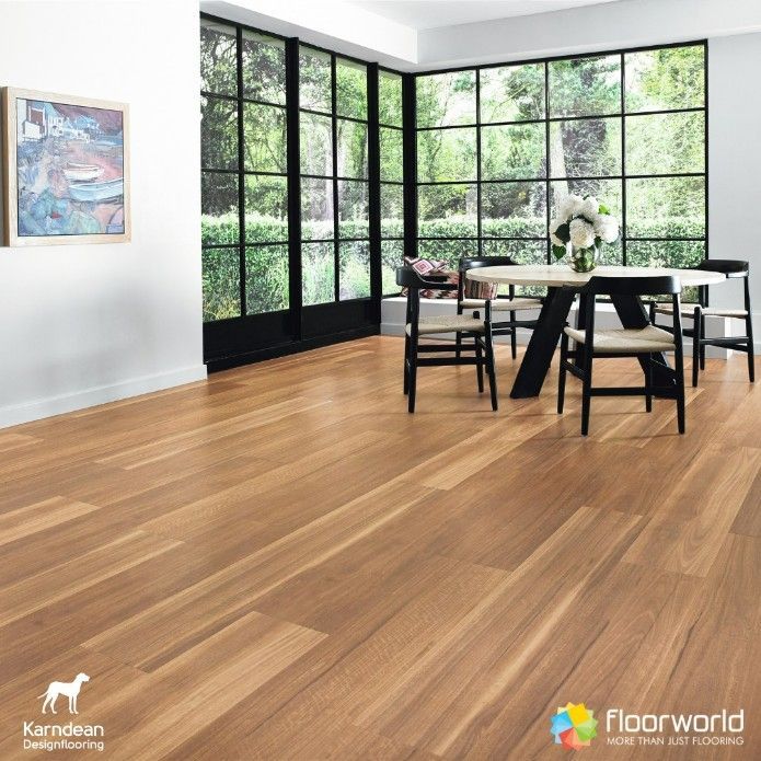 A Living Room With Hardwood Floors and a Table and Chairs — Hoppens Floorworld in Gordonvale, QLD