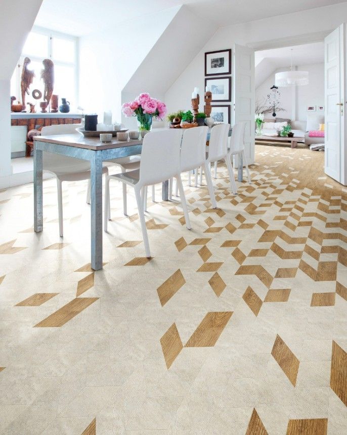 A Dining Room With a Table and Chairs and a Patterned Floor — Hoppens Floorworld in Bentley Park, QLD