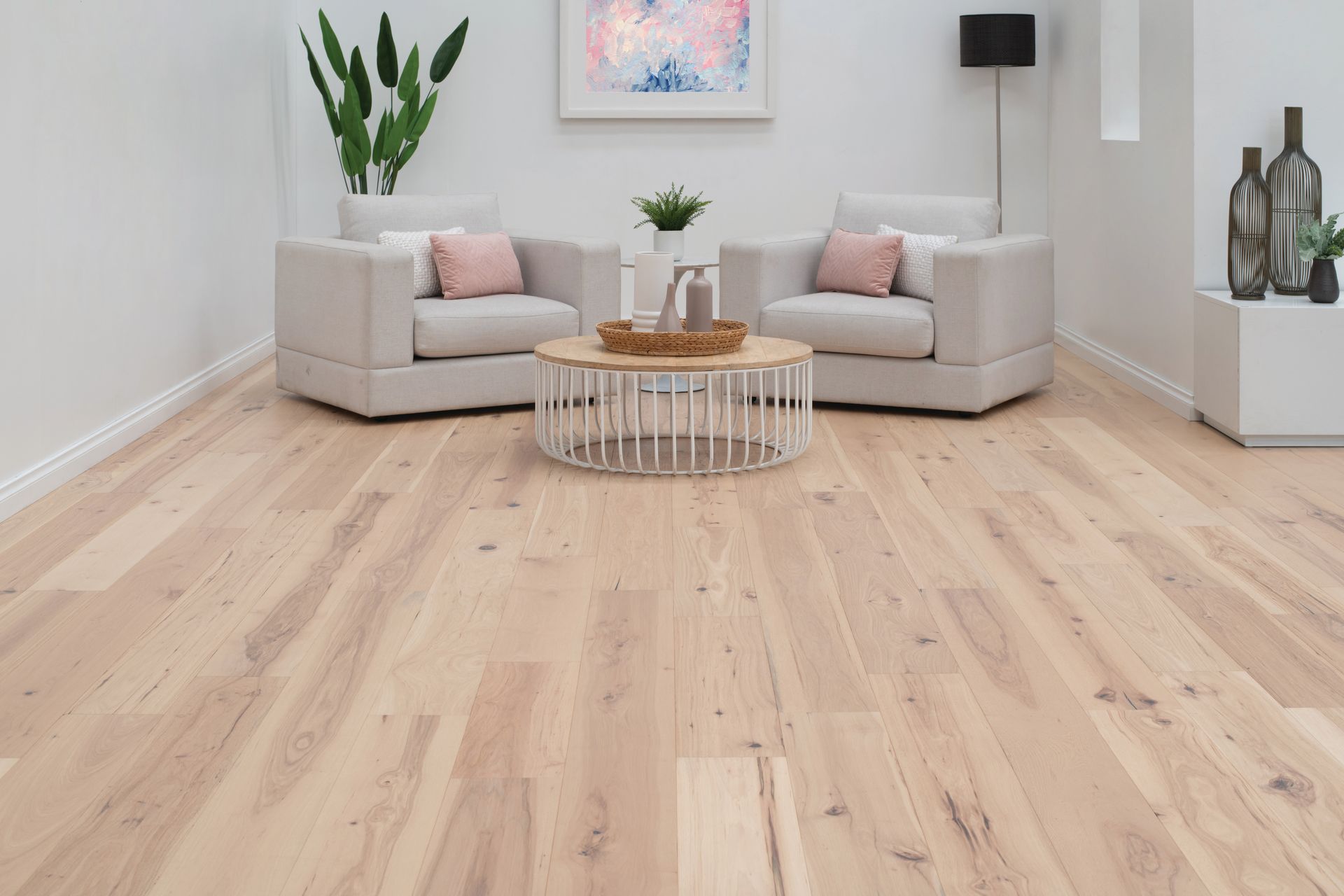 Light-colored Hardwood Floor in a Living Room, With Armchairs, and a Table — Hoppens Floorworld in Bentley Park, QLD