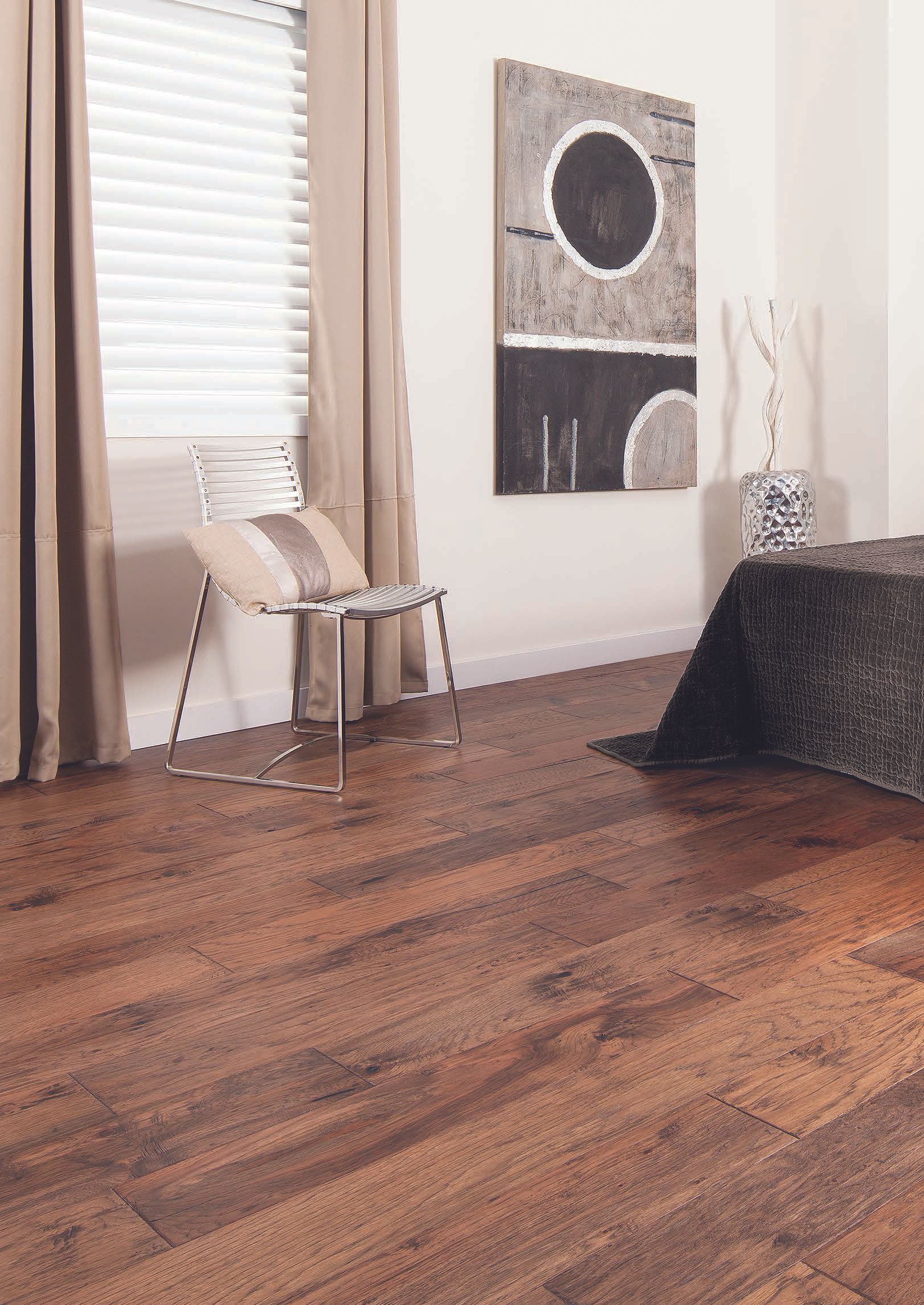 A Bathroom With a Wooden Floor and a Chair — Hoppens Floorworld in Manunda, QLD