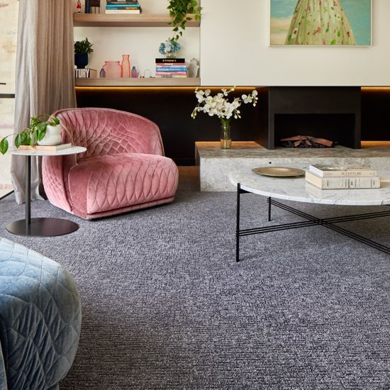 Living Room With a Pink Armchair, Marble Coffee Table, and Patterned Gray Carpet — Hoppens Floorworld in Smithfield, QLD