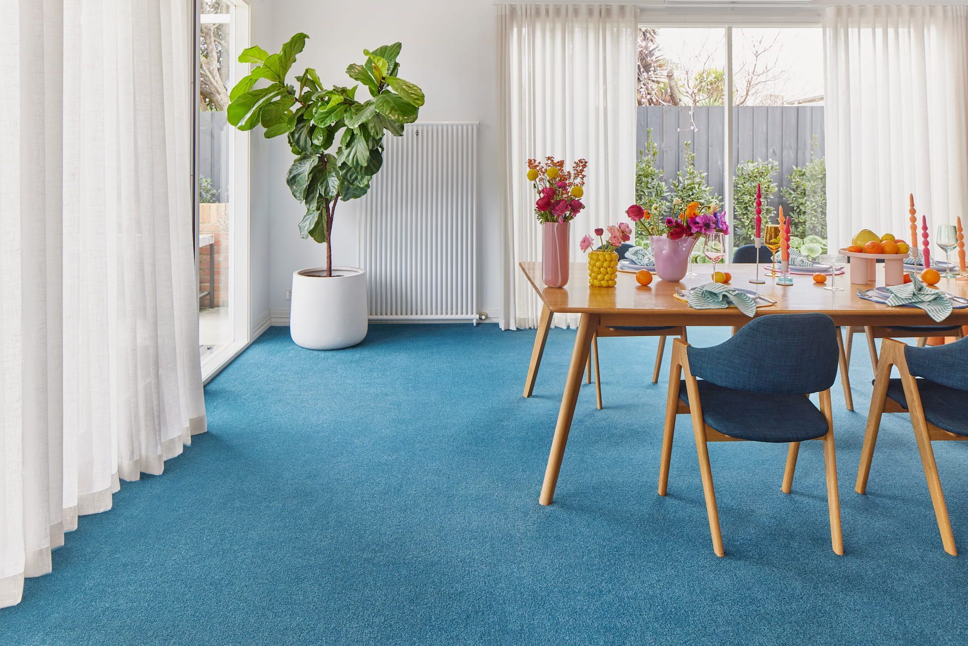 Living Room With Grey Carpet, Sofa, Coffee Table, and a Golden Doodle Dog — Hoppens Floorworld in Smithfield, QLD