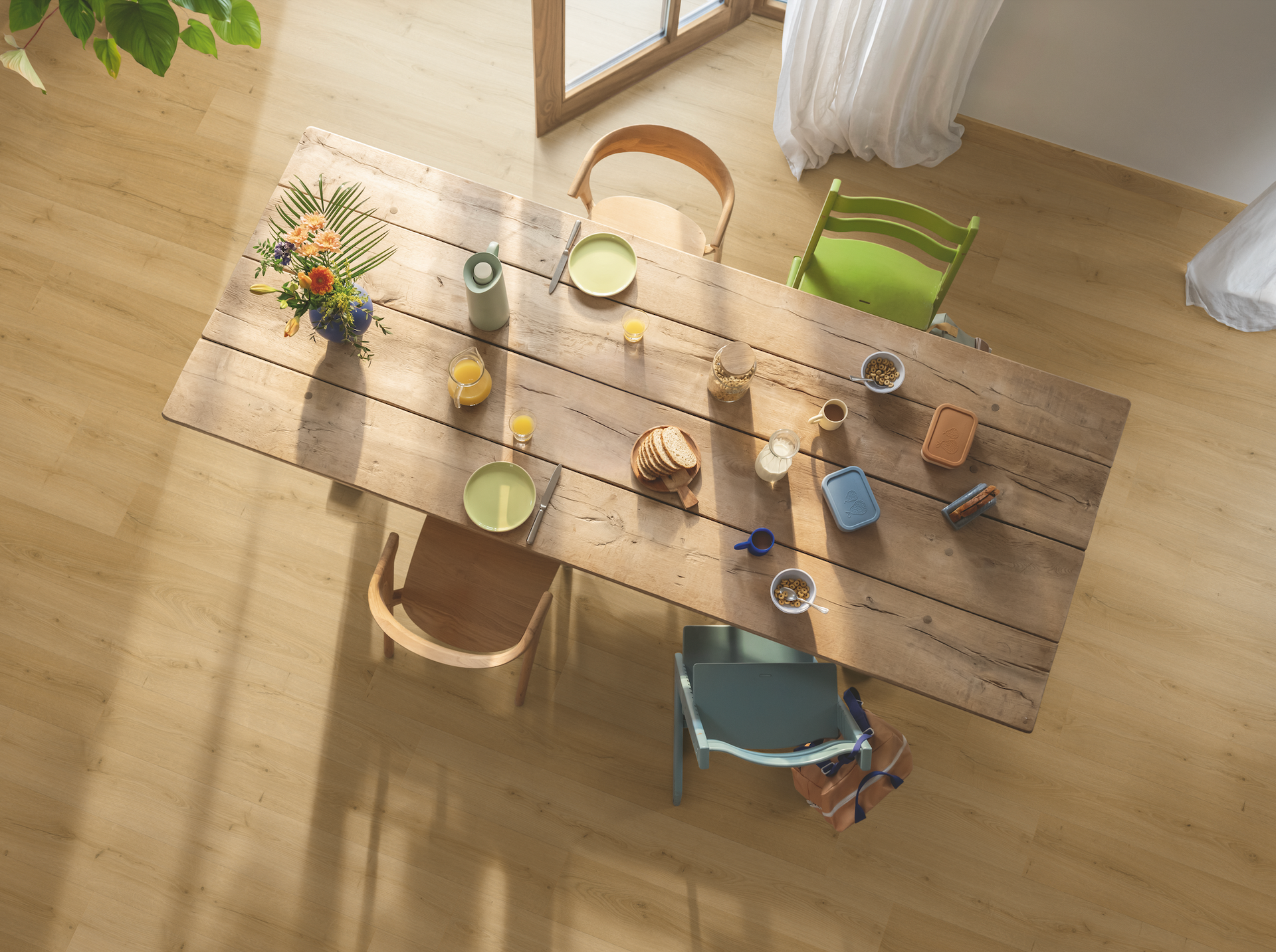 A Bathroom With a Wooden Floor and a Chair — Hoppens Floorworld in Manunda, QLD