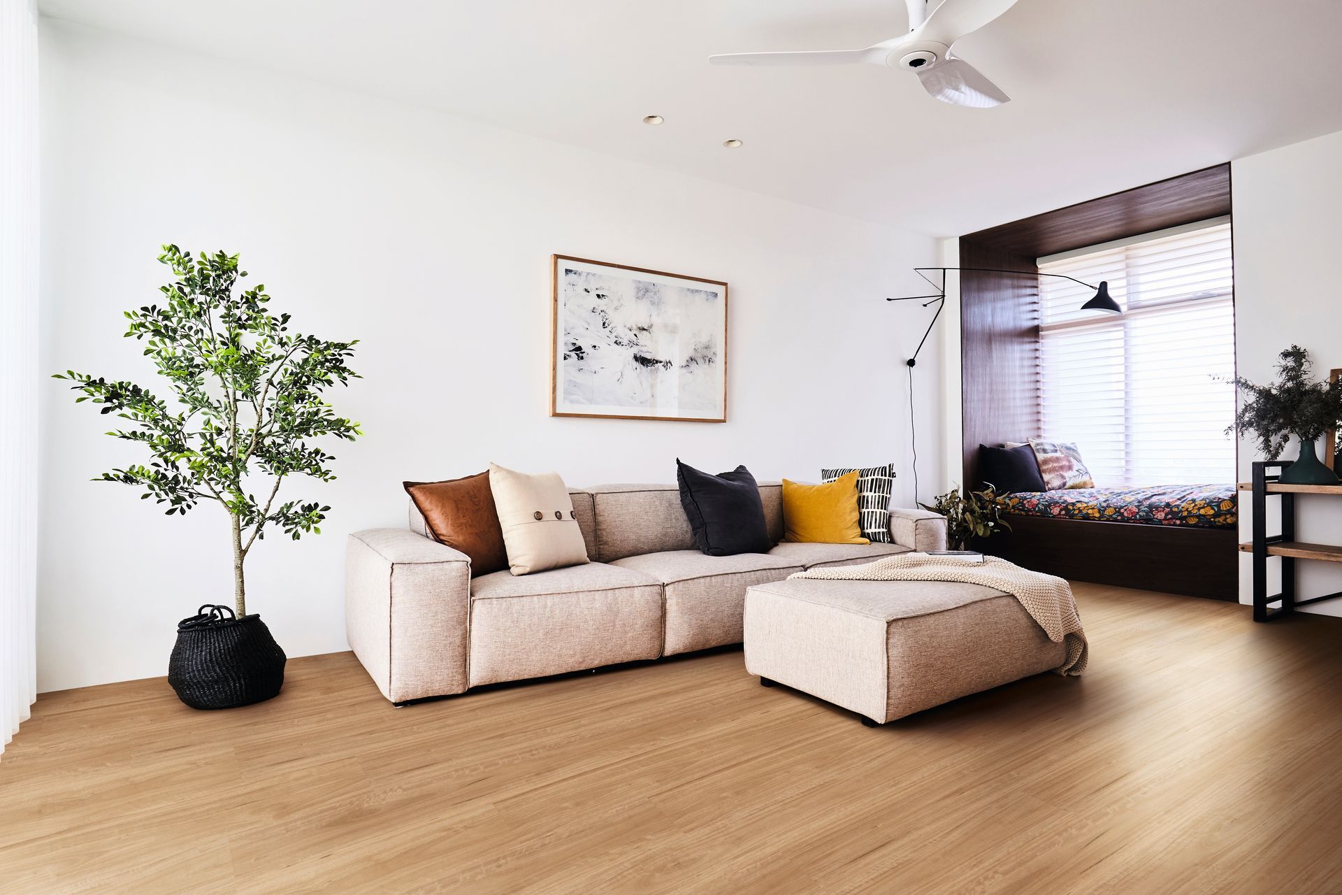 Living Room With Tan Sectional Sofa, Ottoman, and Large Window Seat — Hoppens Floorworld in Bayview Heights, QLD