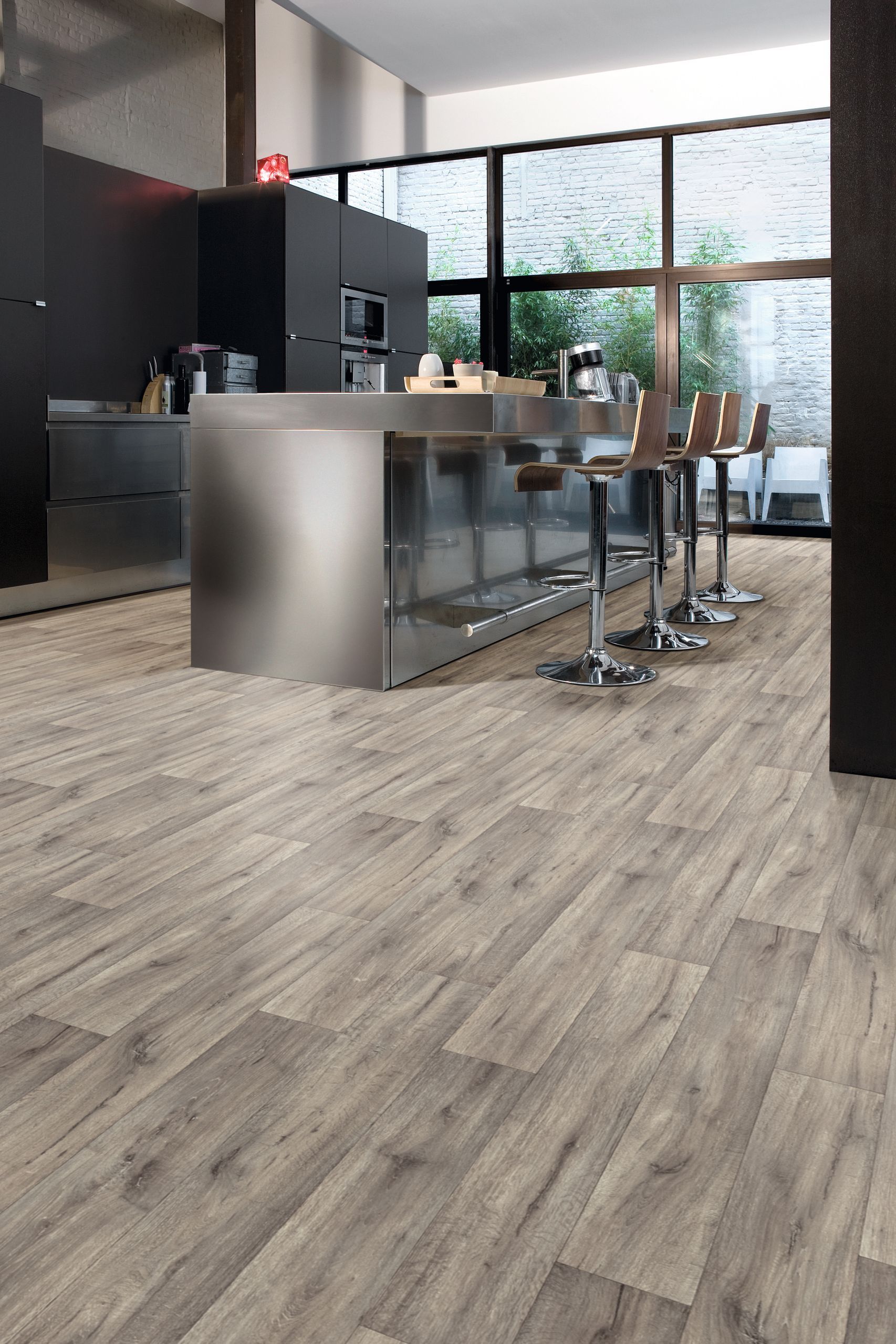 A Bathroom With a Wooden Floor and a Chair — Hoppens Floorworld in Manunda, QLD