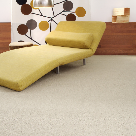 A Yellow Chaise Lounge is Sitting in a Living Room — Hoppens Floorworld in Manunda, QLD