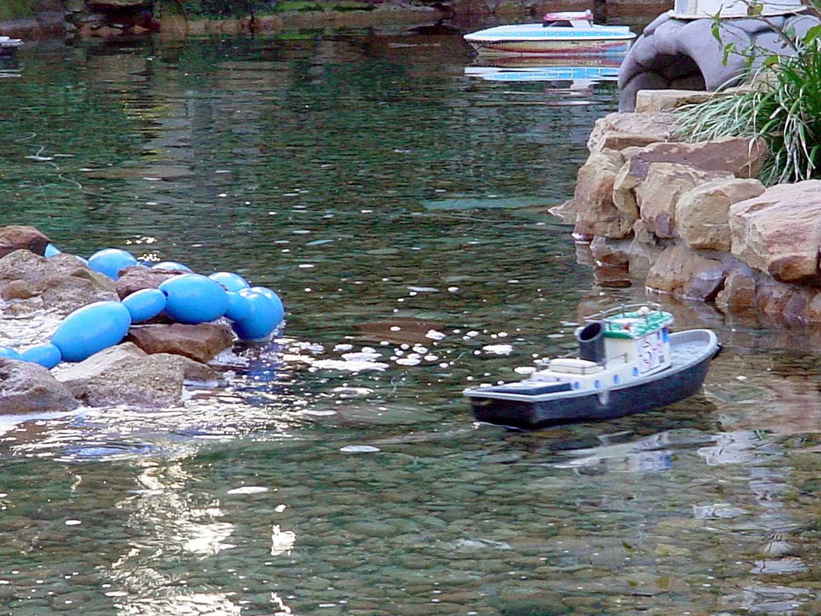 A small boat is floating in a body of water