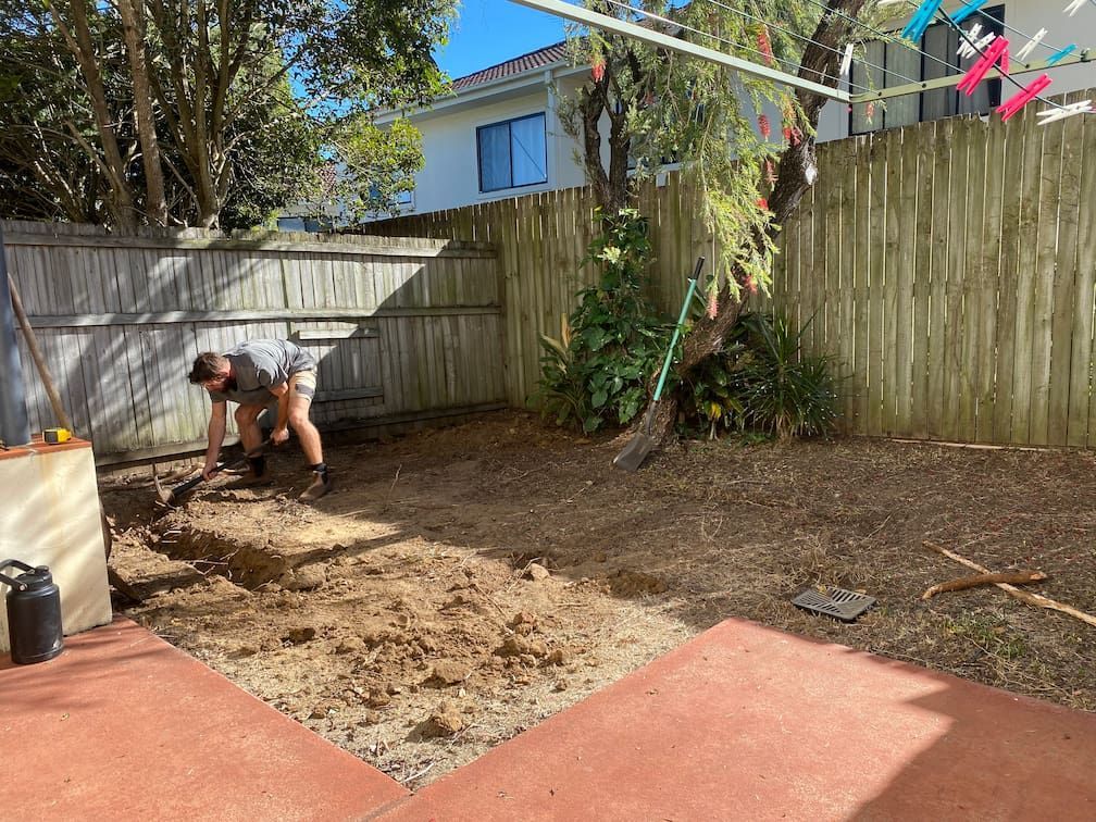 A person digging in a backyard in Brisbane
