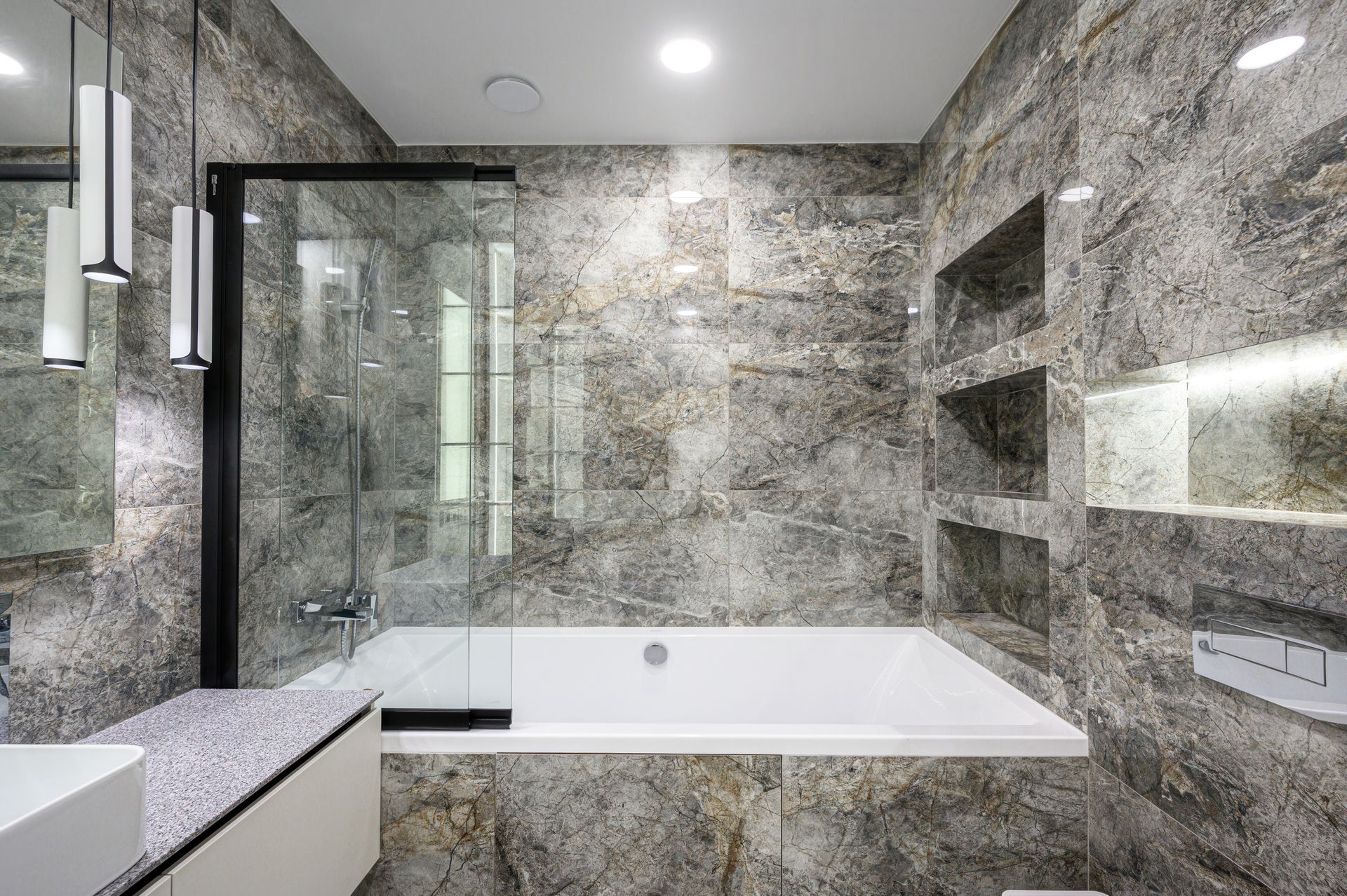 A modern bathroom with a shower screen.