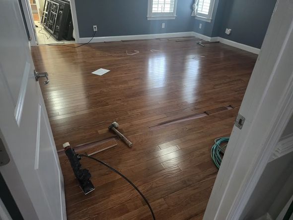 Hardwood planks being installed