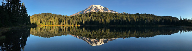 A mountain is reflected in a lake at Mount Rainer NP