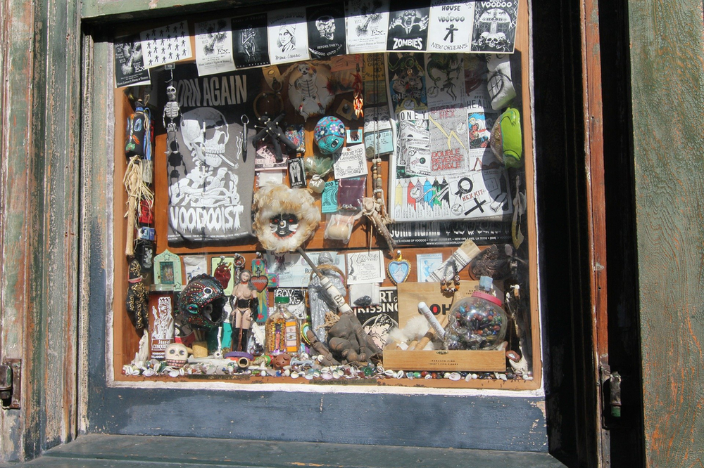 A shop window filled with halloween costumes