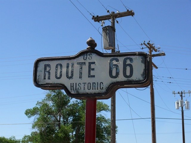 A sign that says route 66 historic on it in seligman