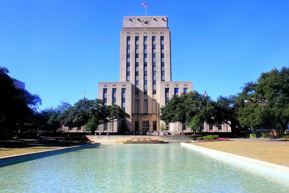 A large building with a fountain in front of it in Houston