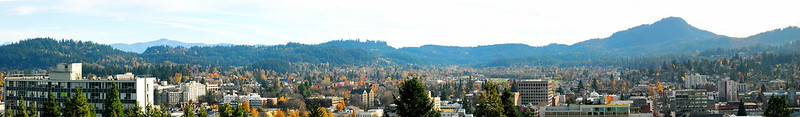 A picture of eugene with mountains in the background.