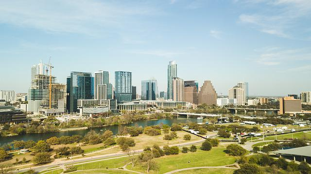 An aerial view of the Austin skyline with a park in the foreground.