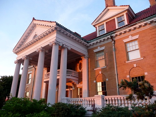 A large brick building with columns and a balcony on the western promenade in portland