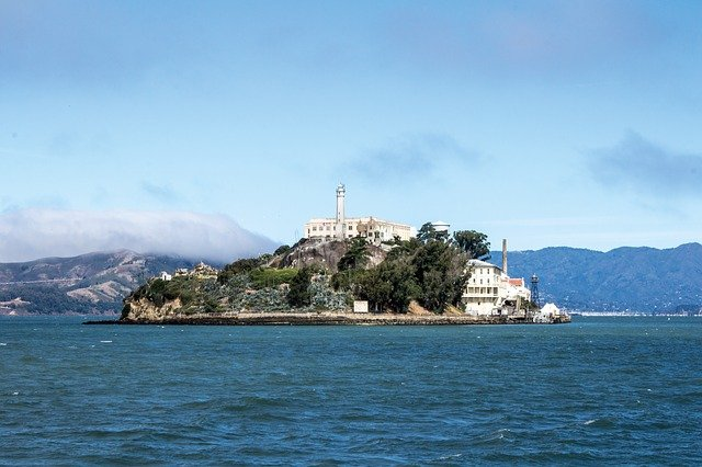 Alcatraz island in the middle of a body of water.