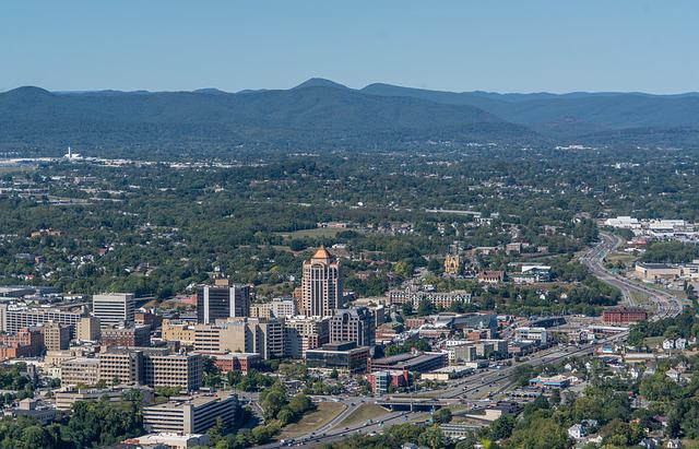An aerial view of Roanoke with mountains in the background.