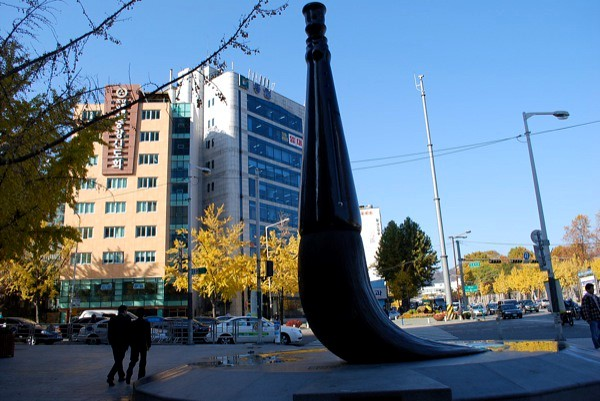 A statue in front of a building on Insadong street