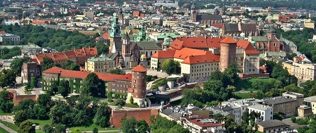 An aerial view of Krakow with a castle in the middle