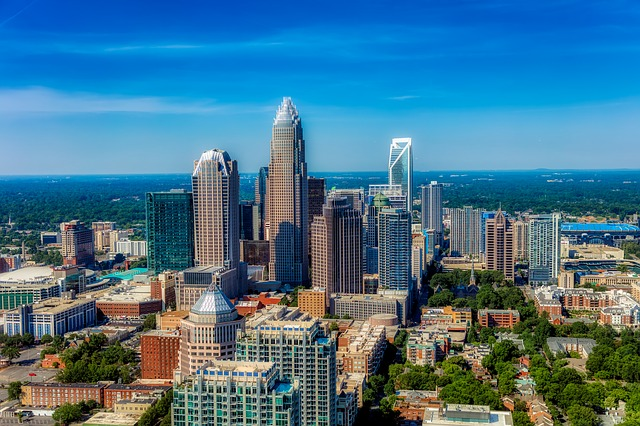 An aerial view of the charlotte skyline on a sunny day.