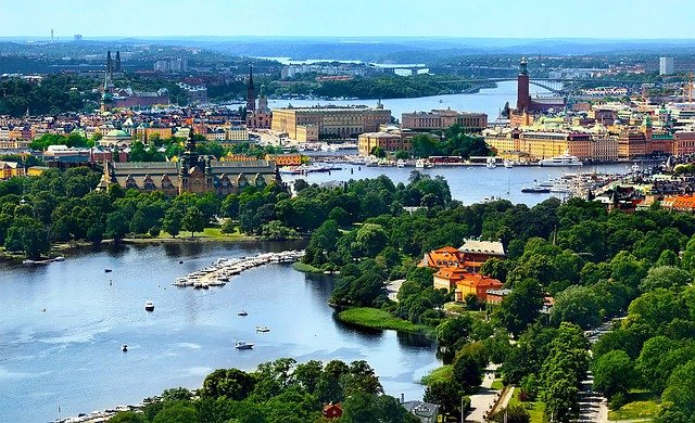 An aerial view of stockholm old town with a lake in the foreground