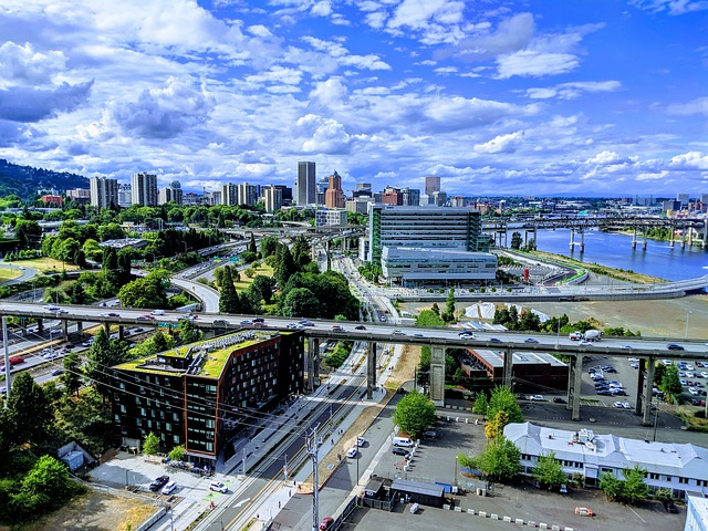 An aerial view of portland with a bridge over a river.